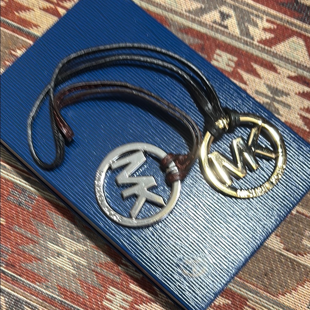 Michael Kors Silver and Gold Logo Keychains. 2 bag charms.